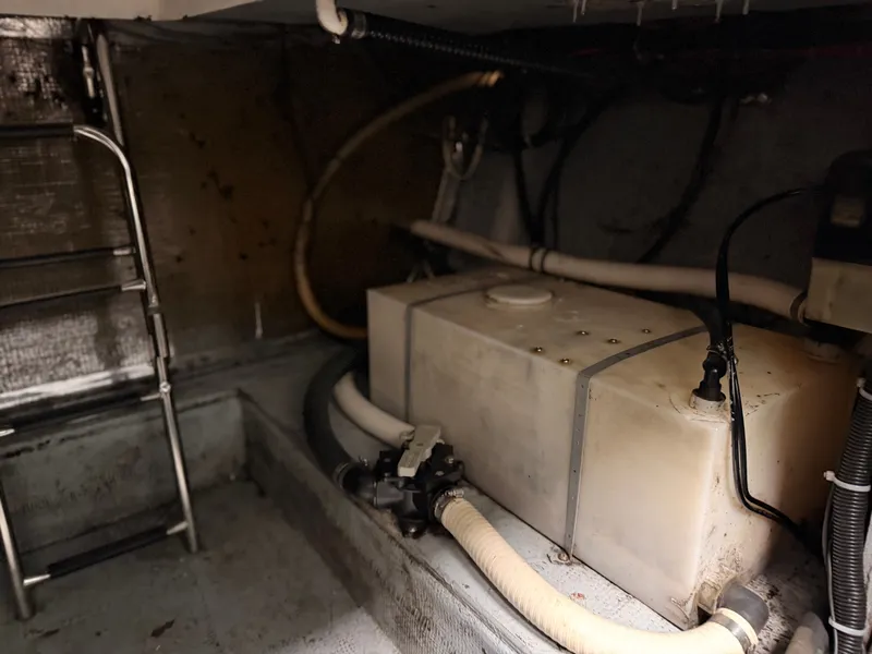 Slide: The Image of Interior of a 2000 Baha Cruisers 272 Fisherman with tanks and hoses. - 46