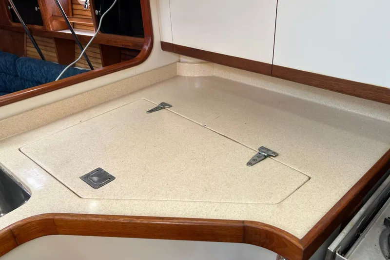 Slide: The Image of Catalina 400 yacht kitchen counter with sink and storage, 1997 model. - 13