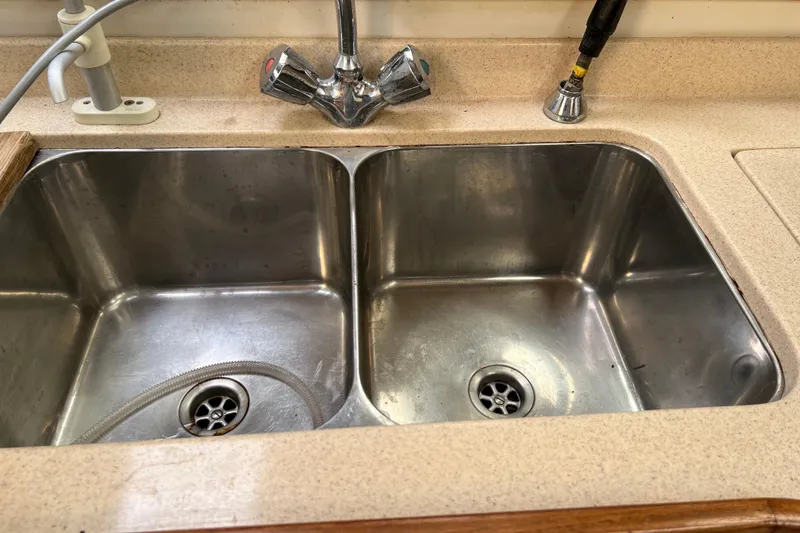 Slide: The Image of Stainless steel double sink with faucet on Catalina 400, 1997 model. - 14