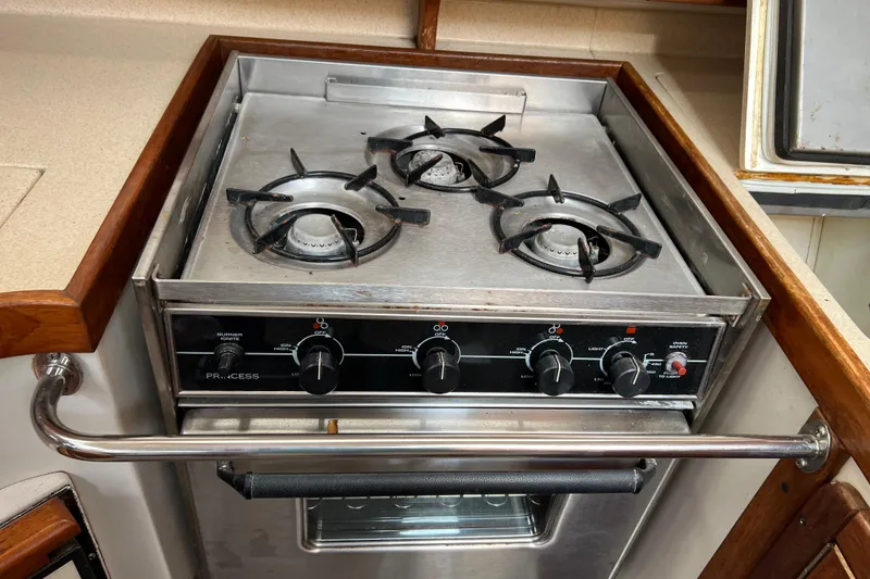 Slide: The Image of Stainless steel stove with three burners on a 1997 Catalina 400 yacht. - 15