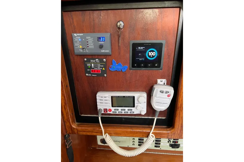 Slide: The Image of Control panel of a 1997 Catalina 400 sailboat with navigation and communication equipment. - 18