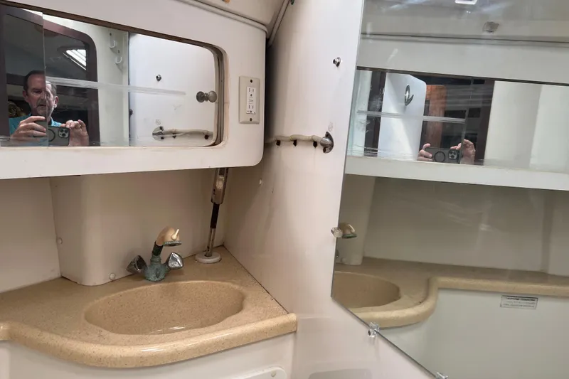 Slide: The Image of Bathroom vanity with mirror and sink in a 1997 Catalina 400 yacht. - 26