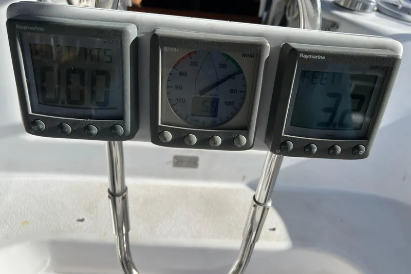 Slide: The Image of Raymarine instruments on a 1997 Catalina 400 sailboat, displaying speed, wind, and depth. - 7