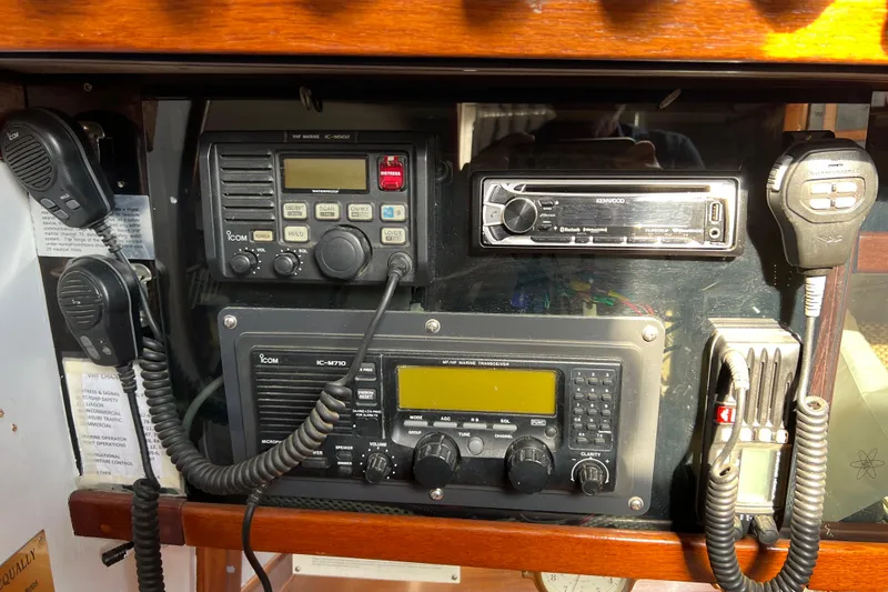 Slide: The Image of 1977 Gulfstar 43 yacht communication equipment with Icom radios and Kenwood stereo system. - 10