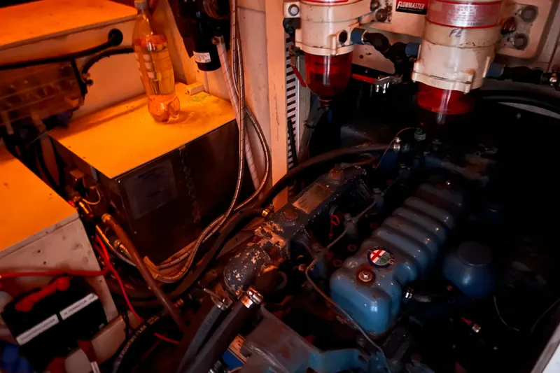 Slide: The Image of Engine room of a 1977 Gulfstar 43 yacht with visible components and wiring. - 14