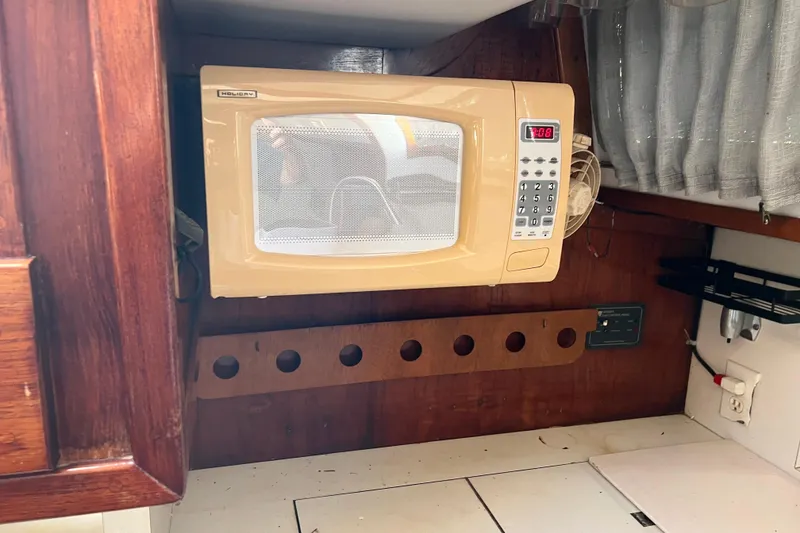 Slide: The Image of Microwave in 1977 Gulfstar 43 yacht kitchen with wooden cabinetry. - 18