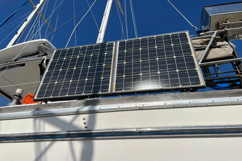 Slide: The Image of Solar panels on a 1977 Gulfstar 43 sailboat under clear blue sky. - 20