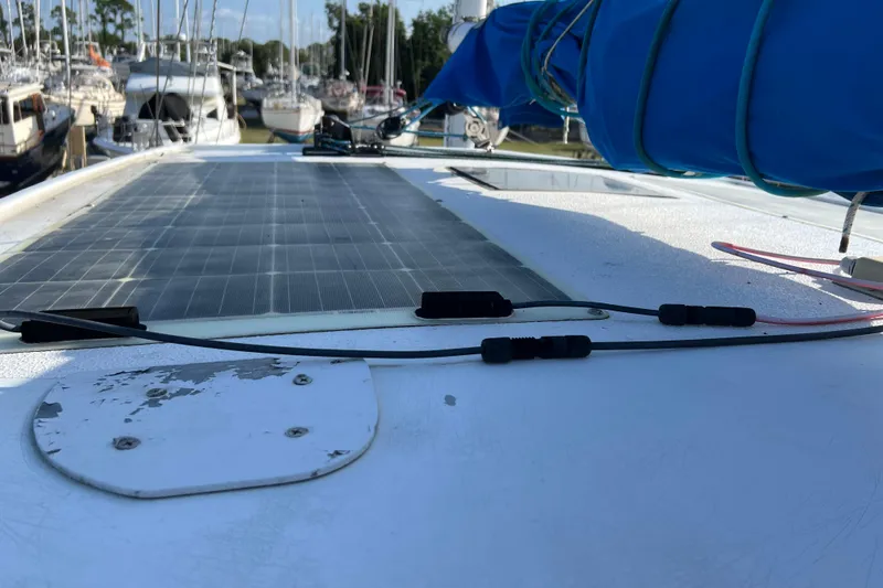 Slide: The Image of 1977 Gulfstar 43 sailboat deck with solar panel and blue sail cover. - 5