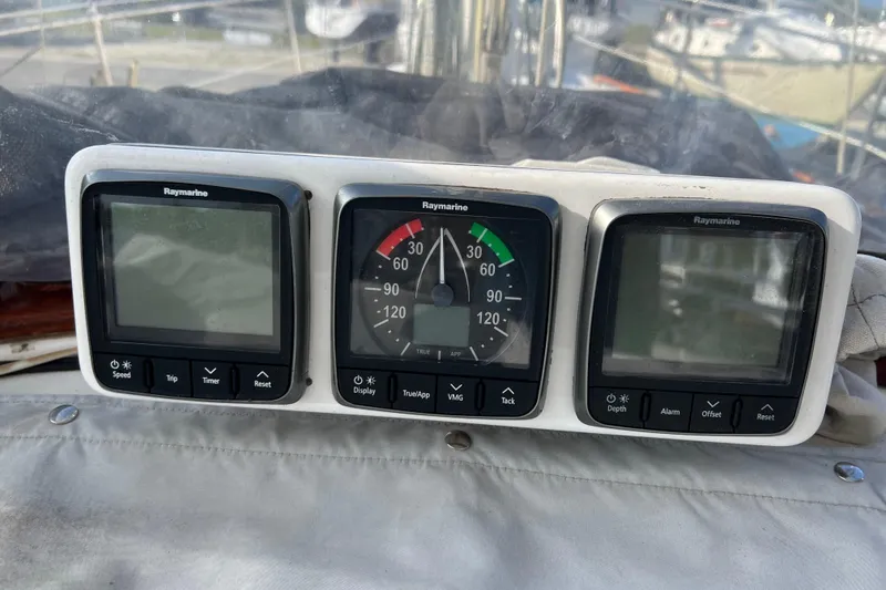 Slide: The Image of Raymarine instrument panel on a 1977 Gulfstar 43 sailboat, featuring speed, wind, and depth displays. - 6