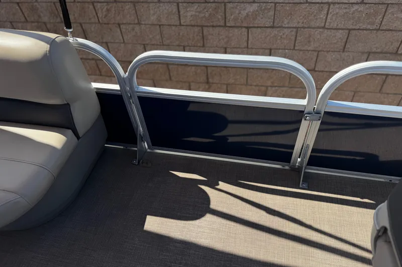 Slide: The Image of 2024 Sun Tracker Bass Buggy 18 DLX interior with seating and railing detail. - 15