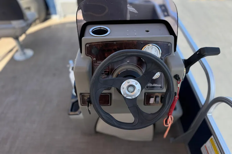 Slide: The Image of Steering console of 2024 Sun Tracker Bass Buggy 18 DLX pontoon boat. - 24