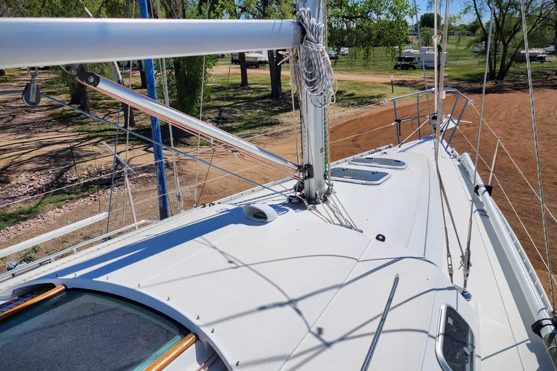 Slide: The Image of Deck view of a 1997 Beneteau First 36s7 sailboat, showcasing rigging and mast. - 10