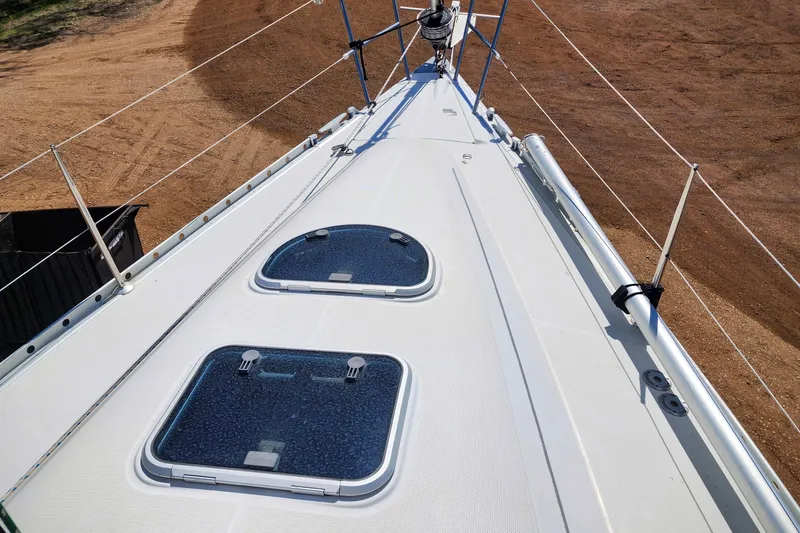 Slide: The Image of Deck view of a 1997 Beneteau First 36s7 sailboat, featuring hatches and rigging. - 11