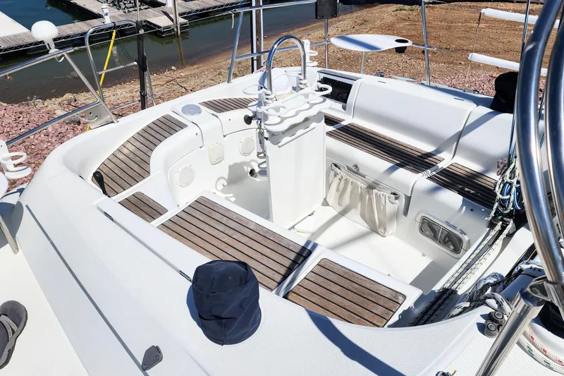 Slide: The Image of Cockpit of 1997 Beneteau First 36s7 sailboat with wooden seating and steering wheel. - 13