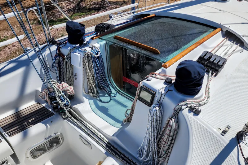Slide: The Image of Deck of 1997 Beneteau First 36s7 sailboat with ropes and winches. - 14