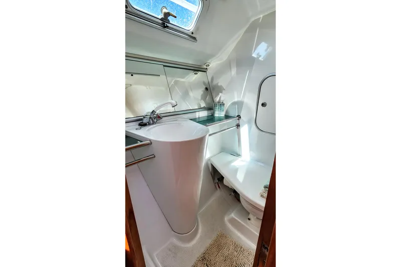 Slide: The Image of Bathroom interior of 1997 Beneteau First 36s7 yacht, featuring sleek design and modern fixtures. - 7