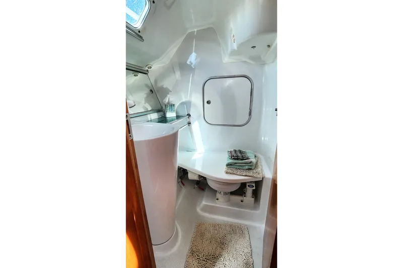 Slide: The Image of 1997 Beneteau First 36s7 yacht bathroom with modern fixtures and compact design. - 8