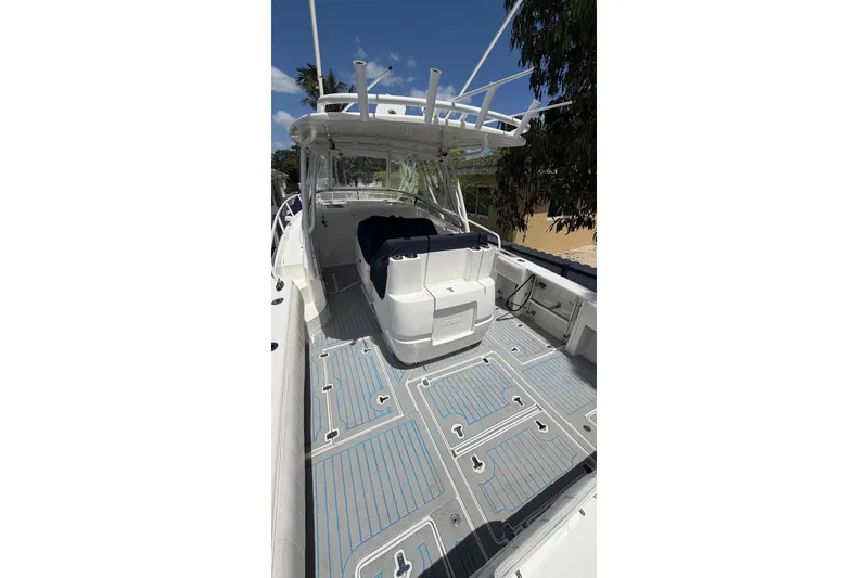 Slide: The Image of 2006 Intrepid 348 Walkaround boat with spacious deck and modern design. - 12