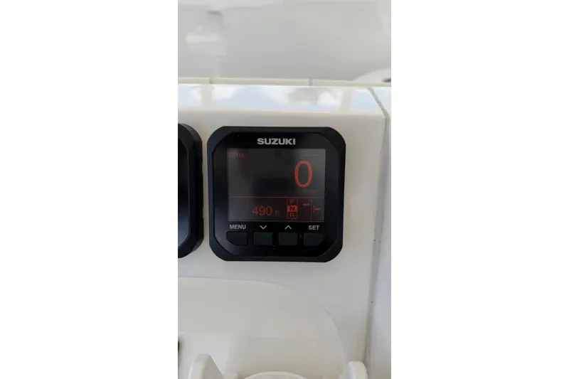 Slide: The Image of Suzuki digital display on 2006 Intrepid 348 Walkaround boat dashboard. - 15