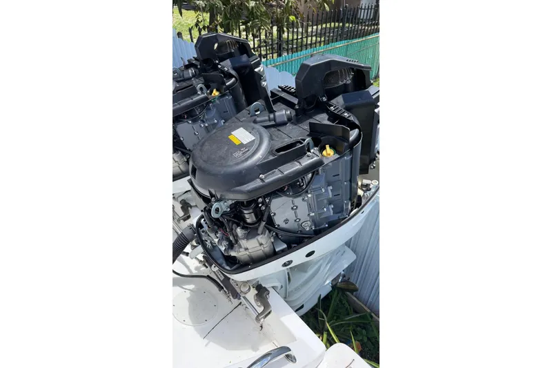 Slide: The Image of Outboard engine of a 2006 Intrepid 348 Walkaround boat, close-up view. - 16