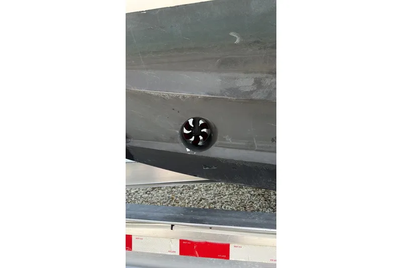 Slide: The Image of Close-up of a 2006 Intrepid 348 Walkaround boat hull with a visible thruster. - 17