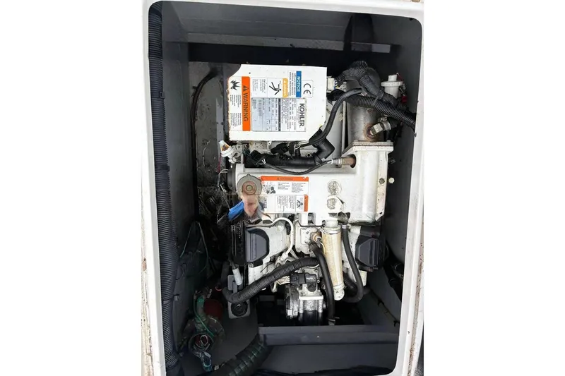 Slide: The Image of Engine compartment of a 2006 Intrepid 348 Walkaround boat, featuring Kohler components. - 20