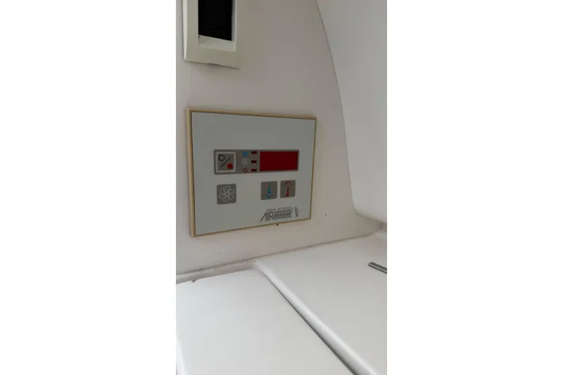 Slide: The Image of Control panel on a 2006 Intrepid 348 Walkaround boat interior. - 4