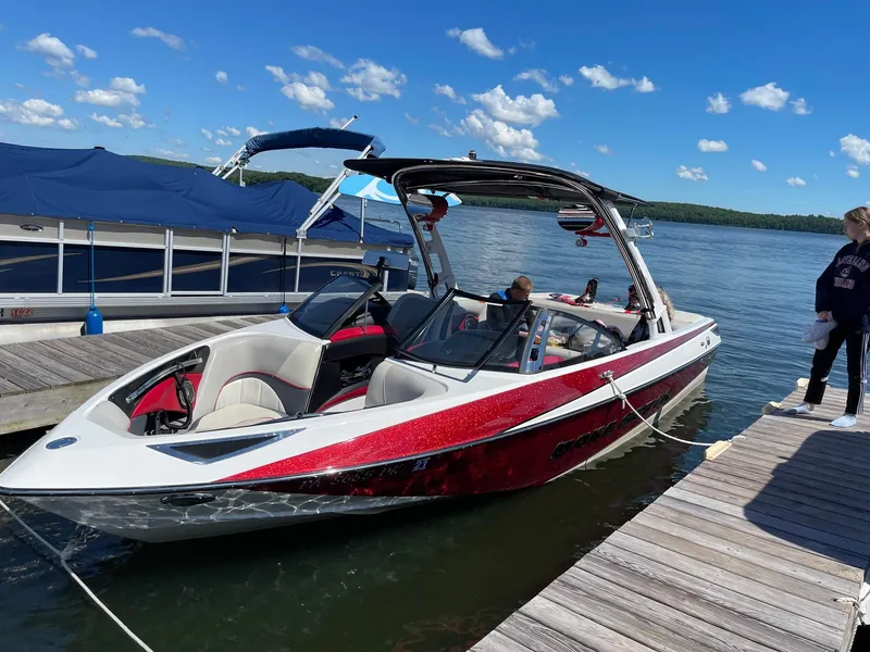 The Image of 2013 Malibu Wakesetter 23 LSV boat docked on a sunny day. - 0