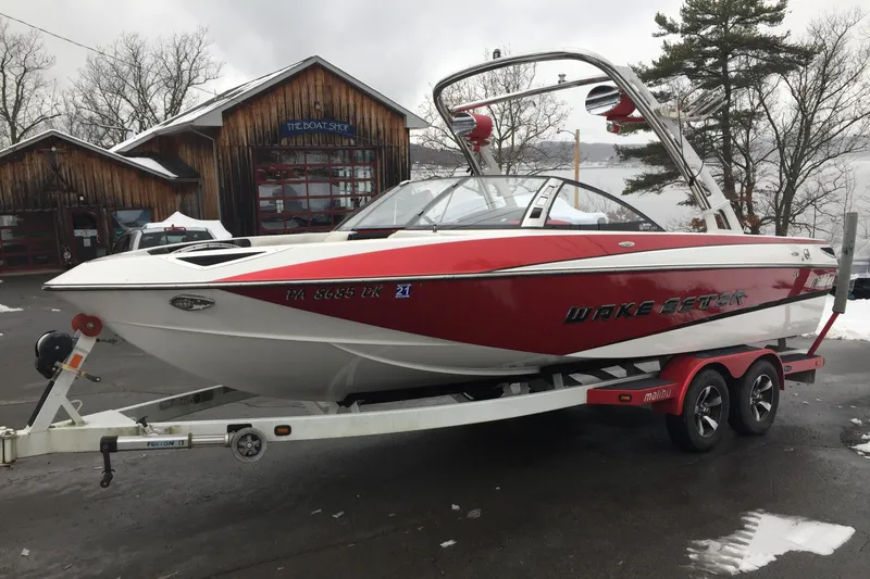 Slide: The Image of 2013 Malibu Wakesetter 23 LSV boat on trailer outdoors. - 3