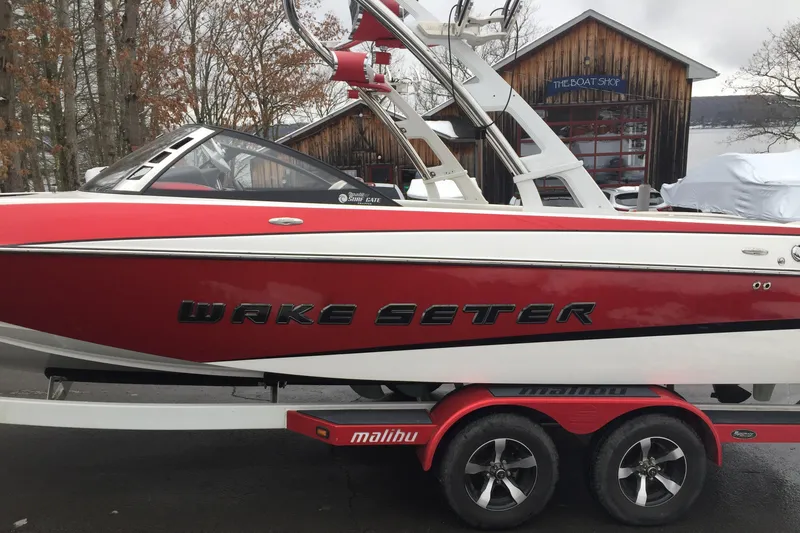 Slide: The Image of Red 2013 Malibu Wakesetter 23 LSV boat on trailer. - 4