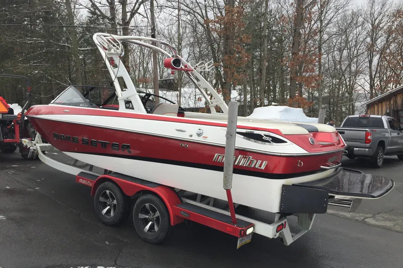 Slide: The Image of 2013 Malibu Wakesetter 23 LSV parked on trailer outdoors. - 5