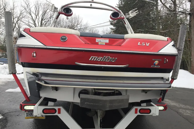 Slide: The Image of Red 2013 Malibu Wakesetter 23 LSV boat on trailer. - 6