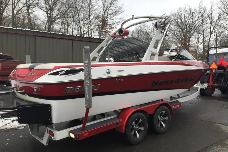 Slide: The Image of 2013 Malibu Wakesetter 23 LSV on trailer, red and white design. - 7