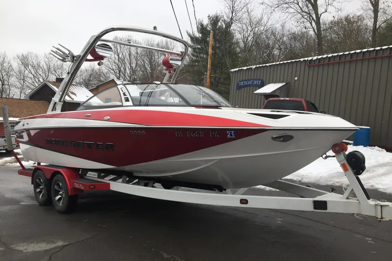Slide: The Image of 2013 Malibu Wakesetter 23 LSV boat on trailer outdoors. - 8