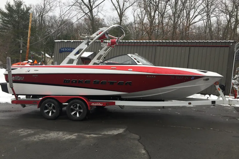 Slide: The Image of 2013 Malibu Wakesetter 23 LSV boat on trailer outdoors. - 9