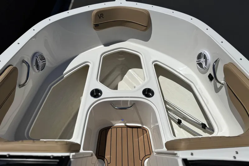 Slide: The Image of 2022 Bayliner VR4 Bowrider I/O interior with seating, speakers, and cup holders. - 11