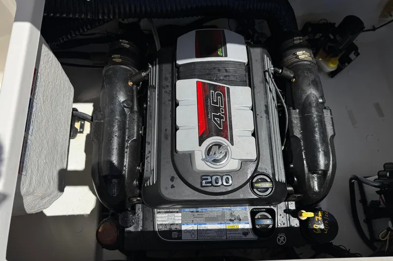 Slide: The Image of Engine compartment of 2022 Bayliner VR4 Bowrider I/O, featuring a 4.5L 200 horsepower engine. - 15