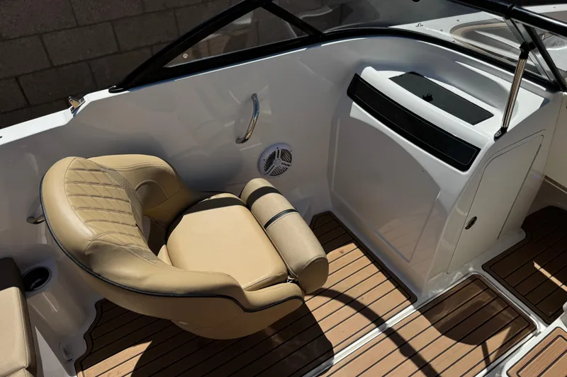 Slide: The Image of 2022 Bayliner VR4 Bowrider I/O interior with tan seating and wood-style flooring. - 18
