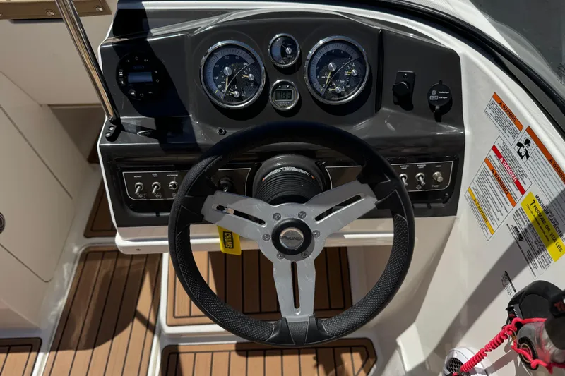 Slide: The Image of 2022 Bayliner VR4 Bowrider I/O dashboard with steering wheel and instrument panel. - 21