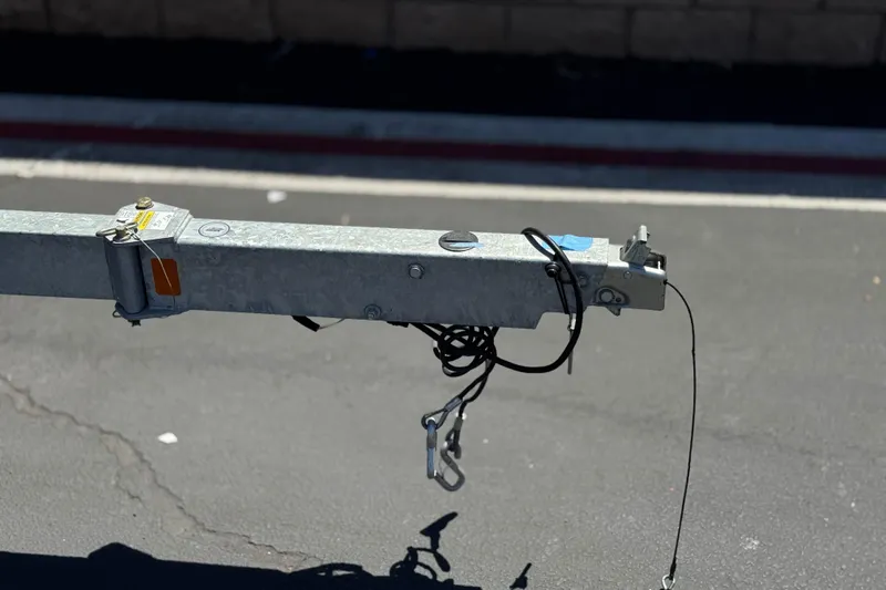 Slide: The Image of Trailer hitch for 2022 Bayliner VR4 Bowrider I/O on asphalt surface. - 23