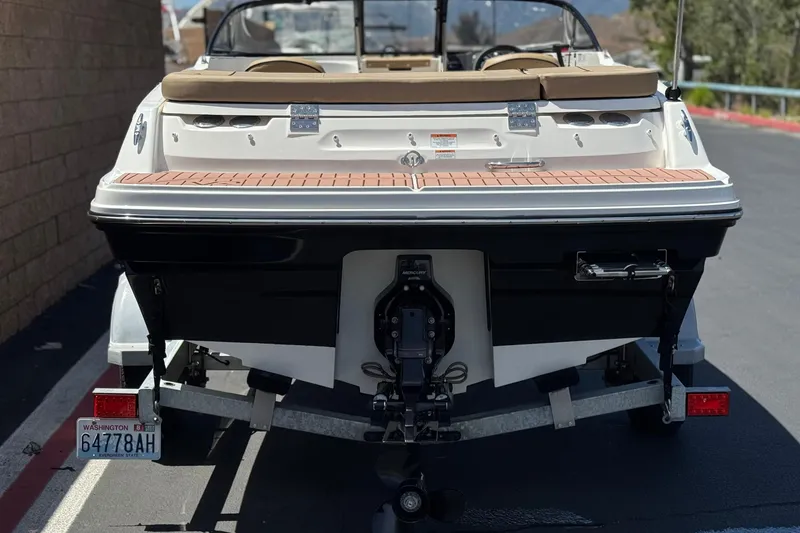 Slide: The Image of 2022 Bayliner VR4 Bowrider I/O boat on trailer, rear view. - 4