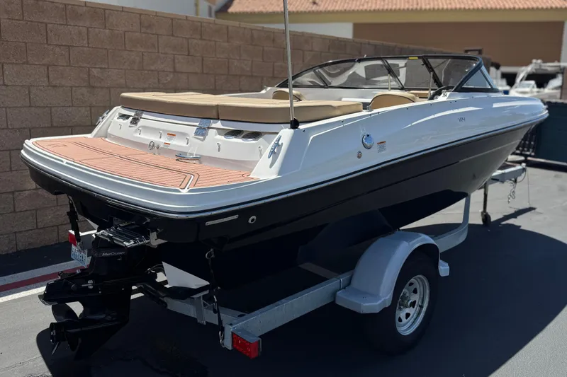 Slide: The Image of 2022 Bayliner VR4 Bowrider I/O on trailer, parked outdoors, rear view. - 5