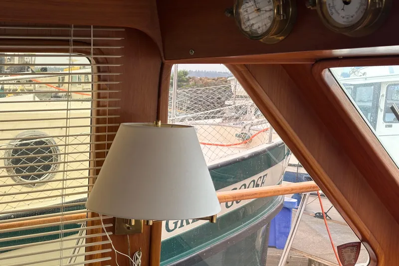 Slide: The Image of Interior view of 1984 Ocean Alexander 38 Double Cabin with nautical decor and window blinds. - 14