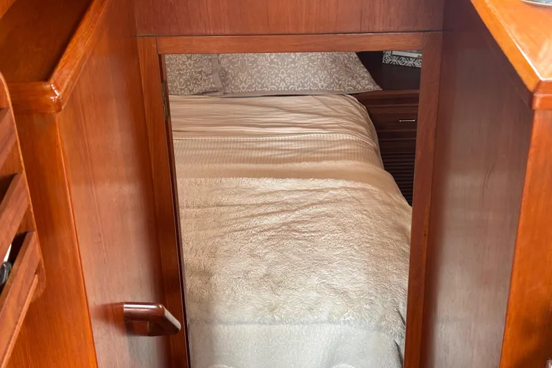 Slide: The Image of Cozy cabin interior of 1984 Ocean Alexander 38 Double Cabin yacht with wooden finish. - 17