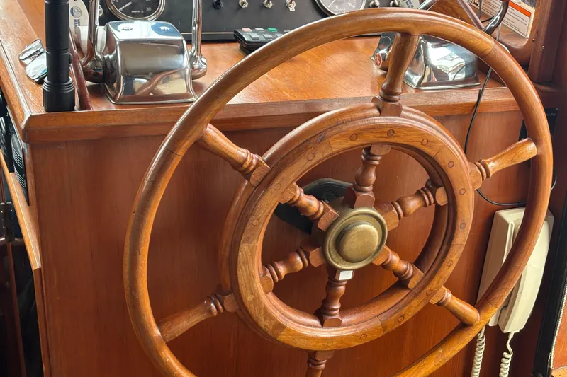 Slide: The Image of Wooden steering wheel of a 1984 Ocean Alexander 38 Double Cabin yacht. - 26