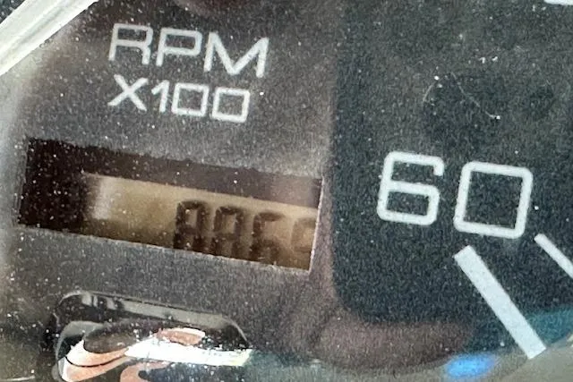 Slide: The Image of Close-up of a 2001 Sea Ray 380 Sundancer RPM gauge displaying 806 RPM. - 13