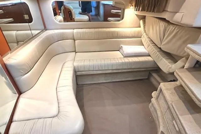 Slide: The Image of Luxurious interior of 2001 Sea Ray 380 Sundancer yacht with plush seating and elegant design. - 18