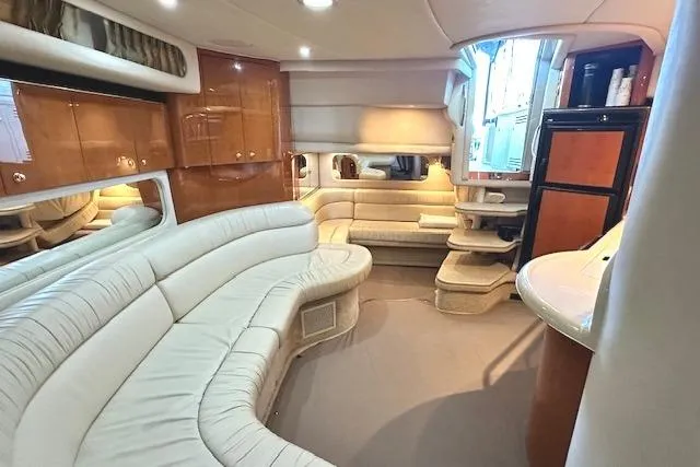 Slide: The Image of Luxurious interior of a 2001 Sea Ray 380 Sundancer yacht with plush seating. - 21