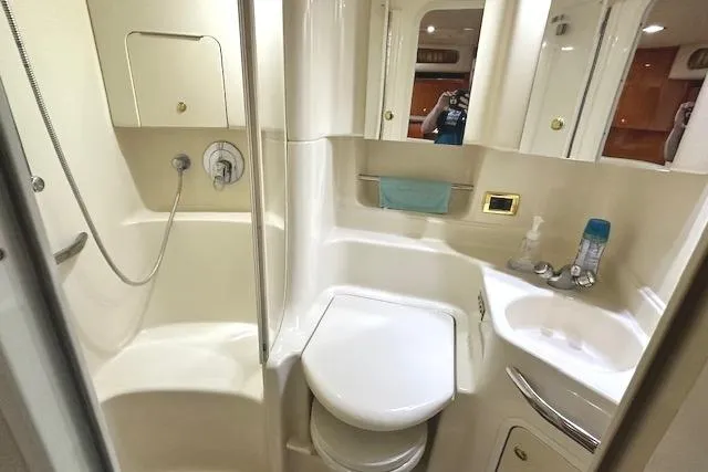 Slide: The Image of Bathroom interior of 2001 Sea Ray 380 Sundancer yacht, featuring shower and sink. - 23