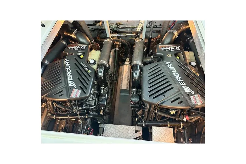 Slide: The Image of Engine compartment of a 2001 Sea Ray 380 Sundancer with twin Mercury engines. - 29